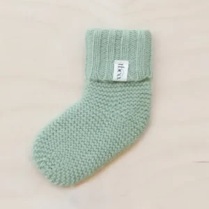 TBCo Merino Wool Baby Socks in Pistachio colour, knitted with ribbed cuff and textured stitch pattern for infants