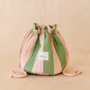 TBCo Cotton Wash Bag in Green Stripe with quilted texture and drawstring closure on pale wood surface